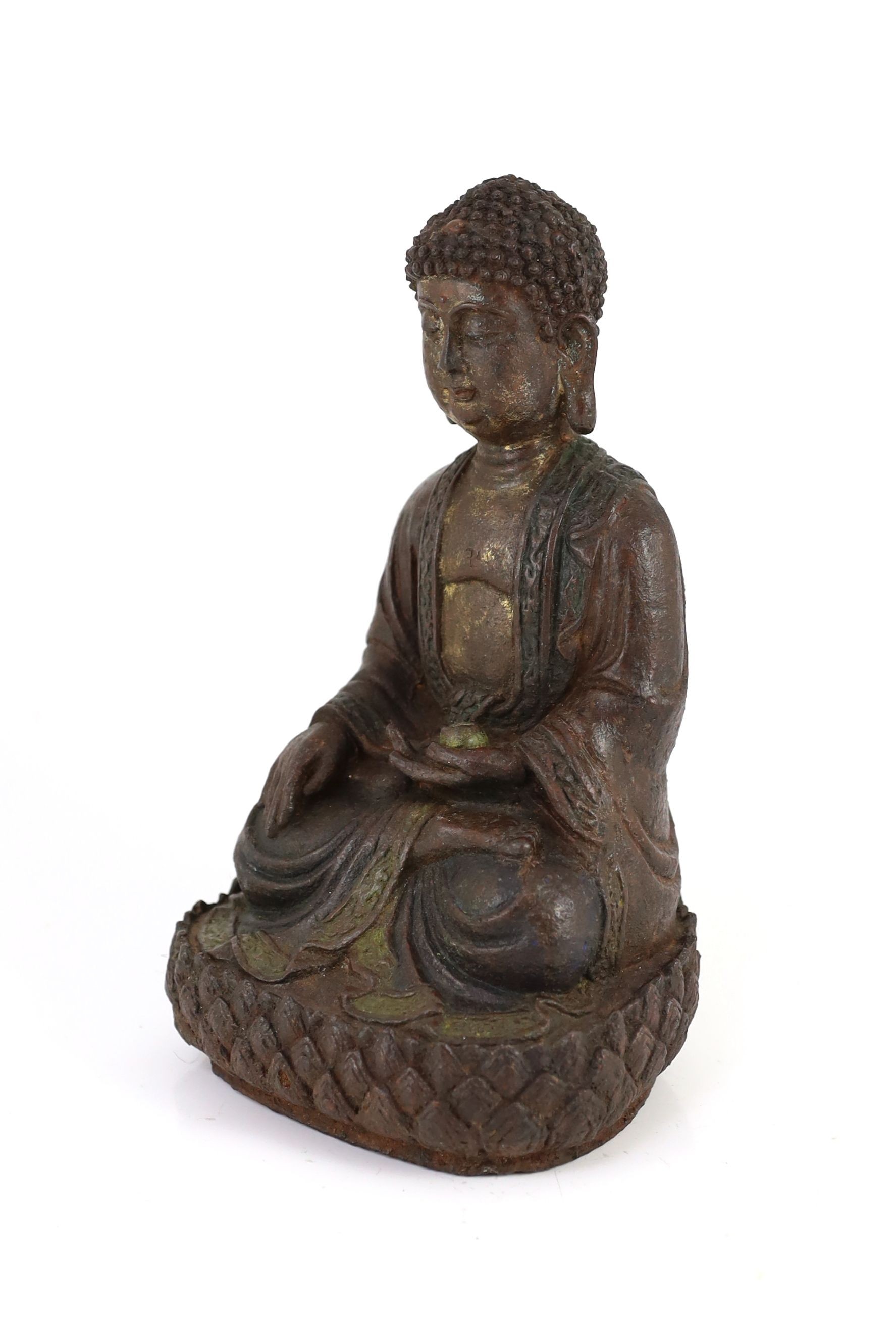 A Chinese Ming cast iron figure of Buddha Shakyamuni, 15th/16th century, 24.5cm high